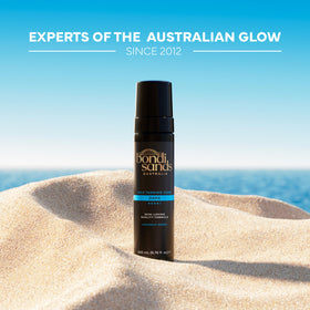 Bondi Sands bottle shown next to hand to indicate product size