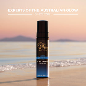 Bondi Sands bottle next to ruler showing compact travel-friendly size