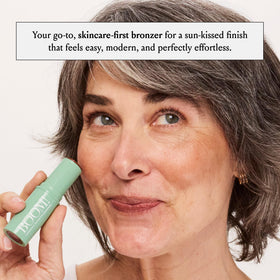 BOOM! by Cindy Joseph applying bronze to cheek for natural contour