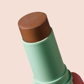 BOOM! by Cindy Joseph swiping bronze on lips for hydrated color
