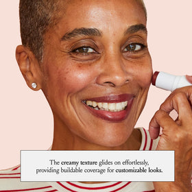 BOOM! by Cindy Joseph boomstick held in hand to show compact travel-friendly size