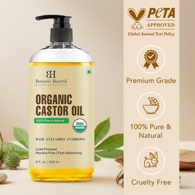 Botanic Hearth bottle and castor seeds flatlay showing raw ingredient focus