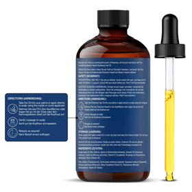 Botanic Hearth oil droplet on fingertip showing lightweight texture and quick absorption