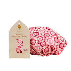 Bounce Curl bonnet front view showing pink satin and secure fit benefit