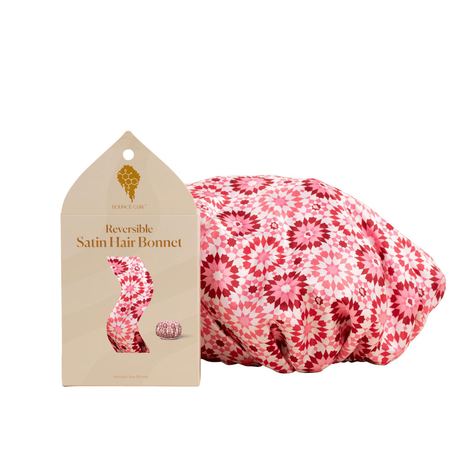 Bounce Curl bonnet front view showing pink satin and secure fit benefit