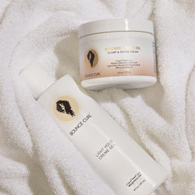 Bounce Curl being applied to damp wavy hair for enhanced curl shaping