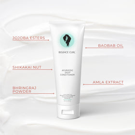 Creamy conditioner texture in hand demonstrating Bounce Curl slip for gentler detangling