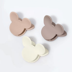 BOUNIQ clip in a purse pocket showing travel-ready compact design and quick on-the-go fix