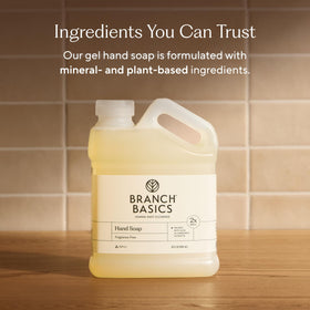 Branch Basics pouring refill into glass bottle for a waste-reducing benefit