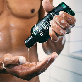 Brickell men's acne face wash pump in hand demonstrating easy dispensing