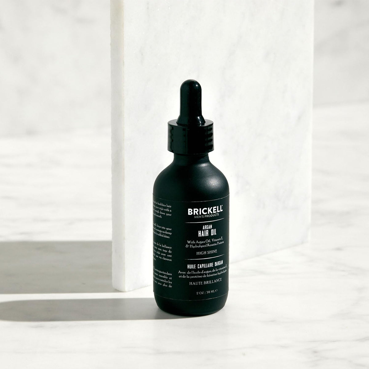 Brickell Men's Argan Oil key ingredients display of argan oil keratin and vitamin E