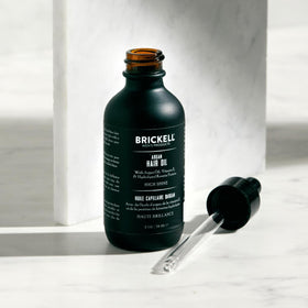 Brickell Men's Argan Oil texture on hand illustrating lightweight absorption benefit