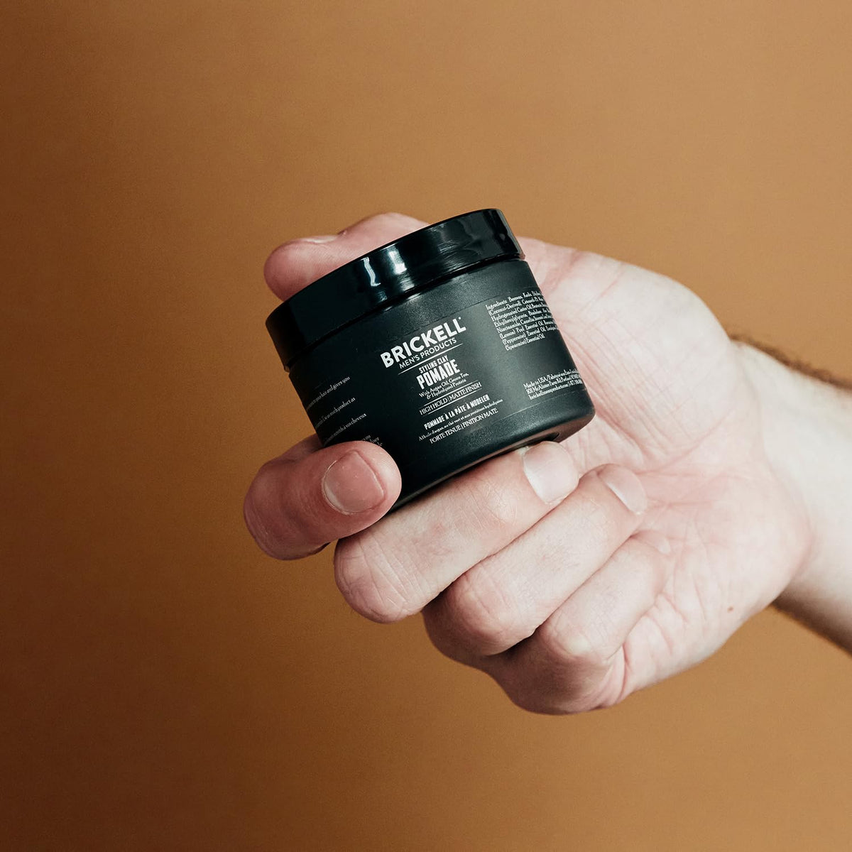 Brickell Men's Products in-hand application showing scoop and spread for easy styling