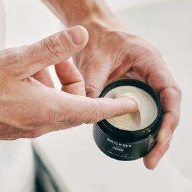 Brickell Men's Products applied in barbershop setting demonstrating professional matte finish