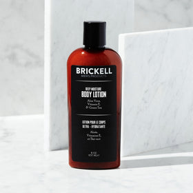 Brickell Men's Products open cap with lotion texture showing fast absorption benefit