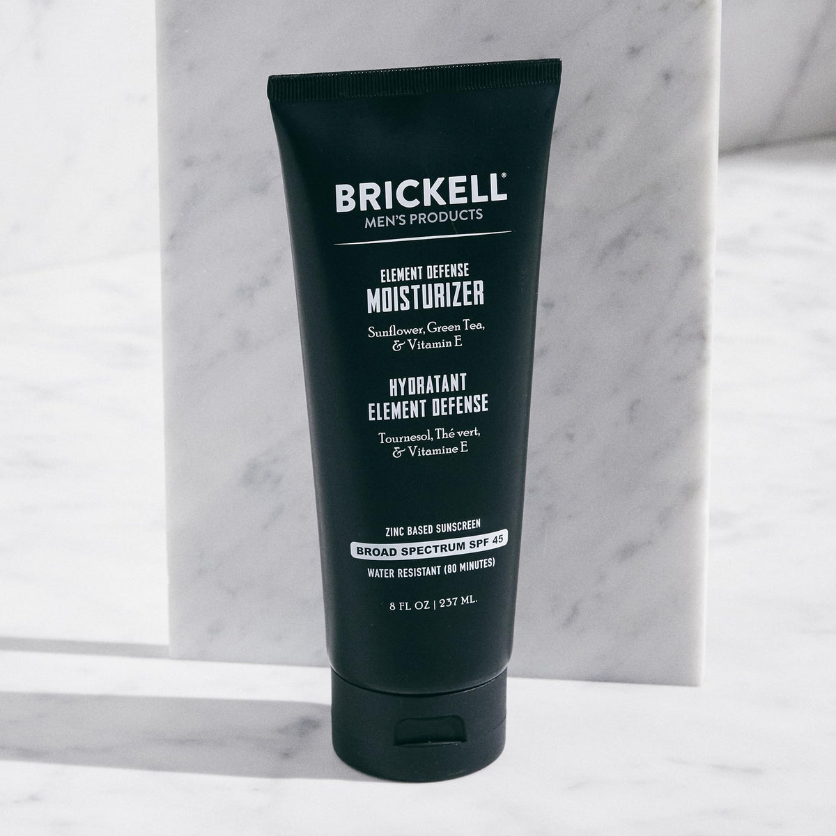 Brickell Element Defense cream texture close-up demonstrating quick absorption