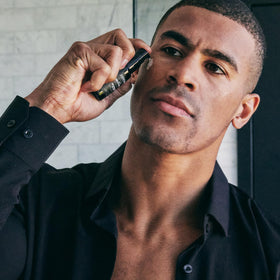 Brickell Men's serum on bathroom counter in morning routine setting for convenience