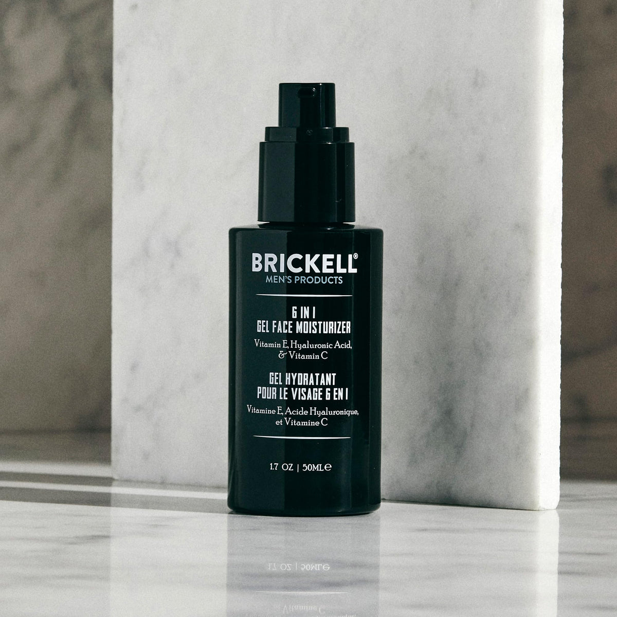Brickell Men’s 1.7 oz tube next to common items to show true size