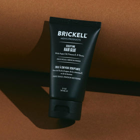 Brickell tube held in hand to show scale and convenience for travel or gym bags