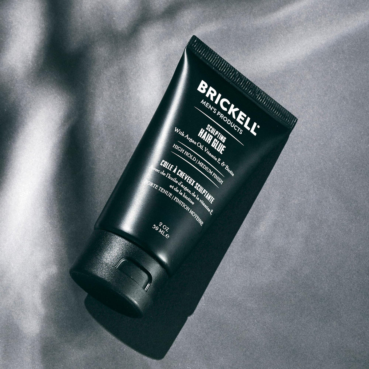 Brickell hair glue tube label detail highlights ingredients and packaging for easy identification