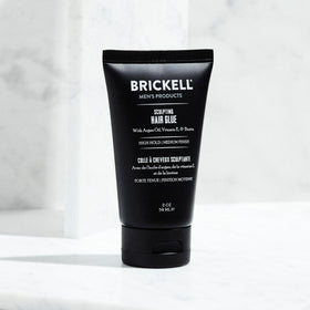 Argan oil and vitamin E beside Brickell product illustrating nourishing ingredients and protection