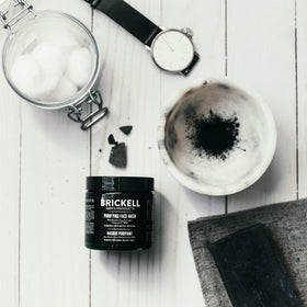 Man applying Brickell mask to face, demonstrating easy at-home detox benefit