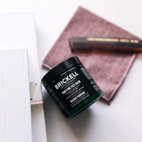 Rinsing Brickell mask from skin at sink, illustrating gentle removal benefit