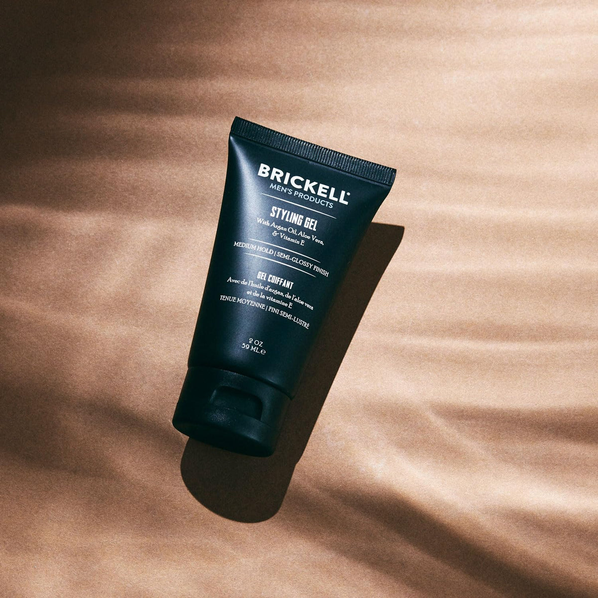 Brickell Men's Products being applied to short hair for controlled styling and shine