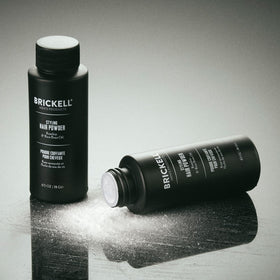 Brickell Men's compact in hand to show size and portability for on-the-go use