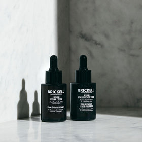 Brickell night serum droplet on skin demonstrating restorative hydration