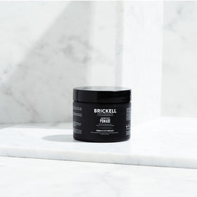 Brickell pomade open jar close-up revealing creamy texture and control benefit for styling