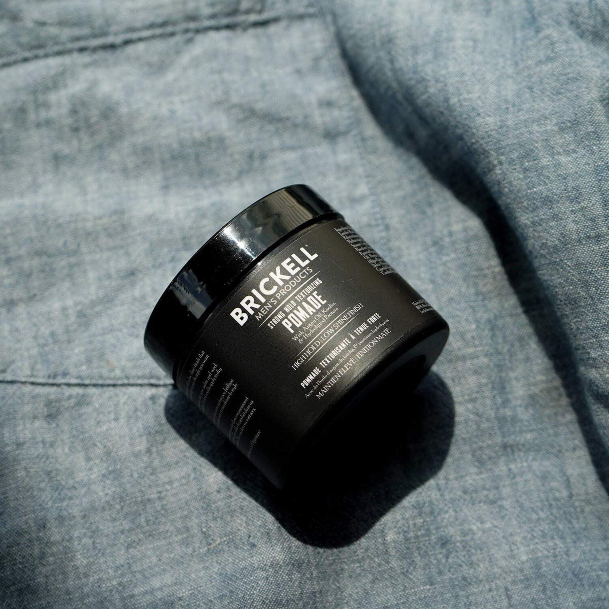 Brickell Men's Products open pomade showing fibrous texture for easy shaping