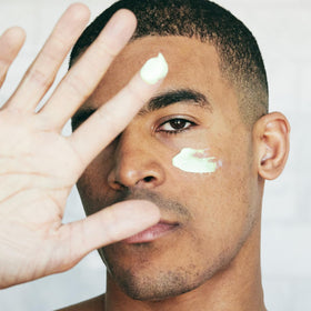 Brickell Men’s retinol cream being applied to hand demonstrating quick absorption