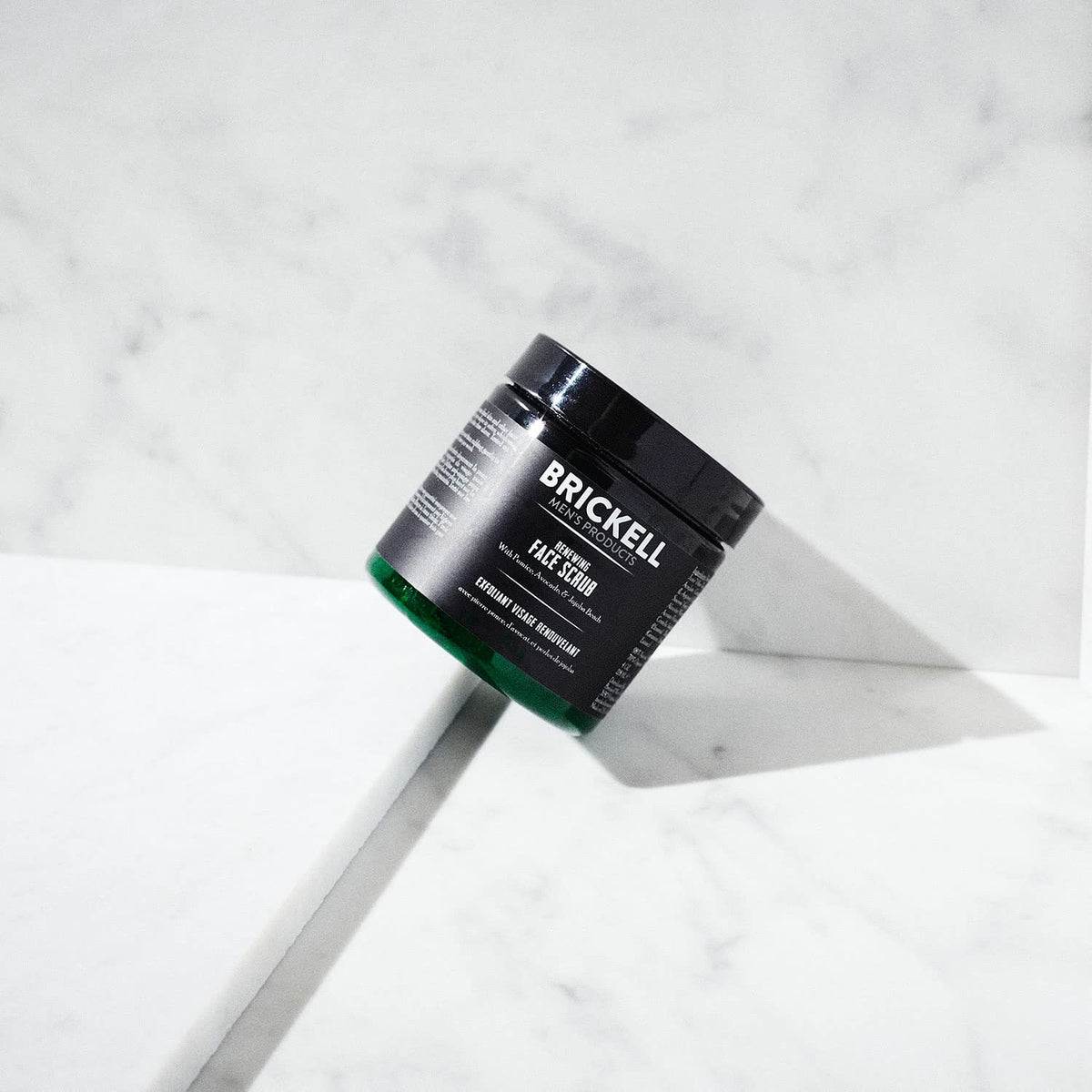 Brickell scrub in hand demonstrating lather and easy application for smooth shave prep
