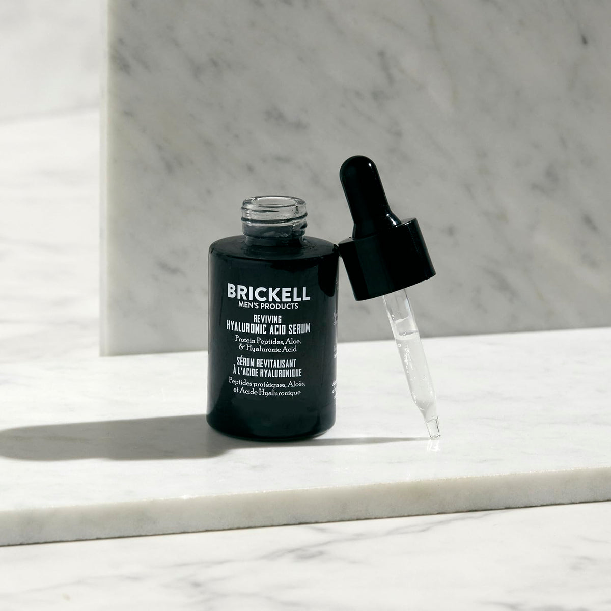 Brickell dropper dispensing clear serum texture for fast absorption