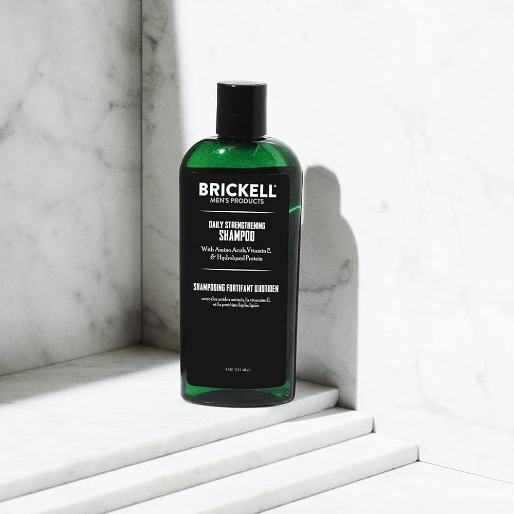 Brickell Men's Products shampoo texture poured on hand highlights lathering benefit