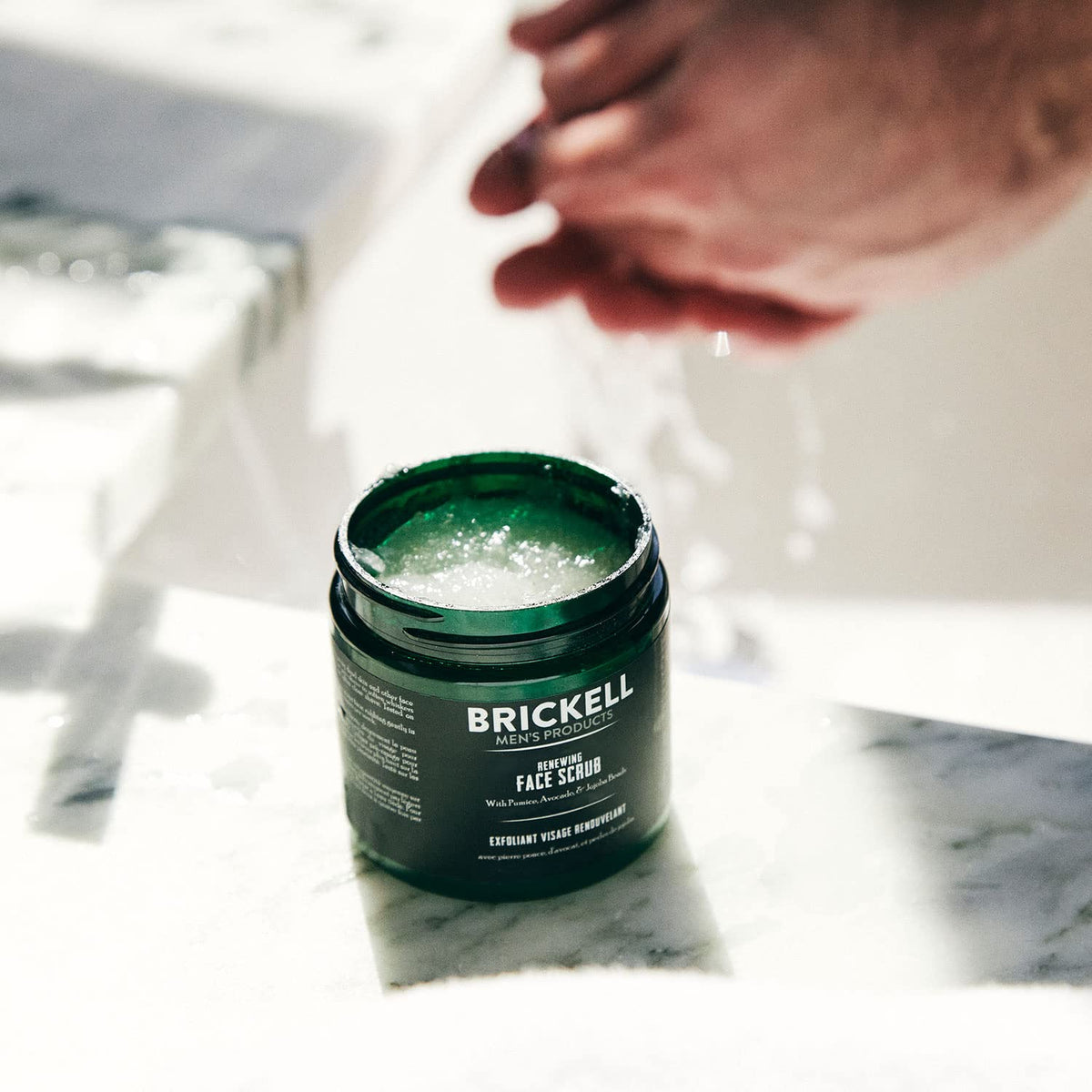 Brickell texture close-up highlighting pumice and jojoba beads for effective exfoliation
