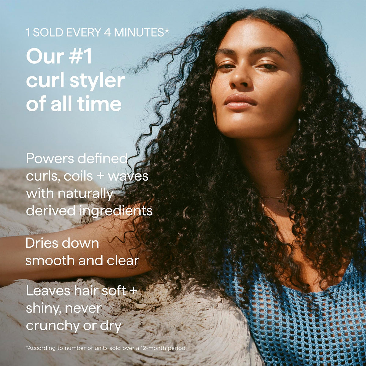 briogeo applying cream to damp curls for frizz control benefit
