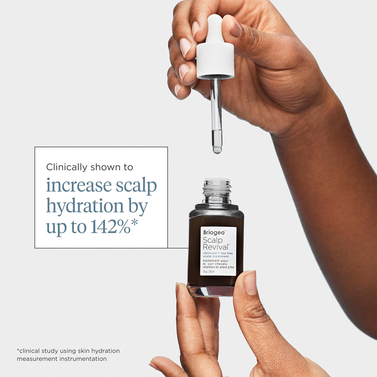 Briogeo bottle held in hand to show 1 oz scale and travel-friendly size