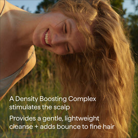 Briogeo shampoo in use with lather on hair demonstrating volume build