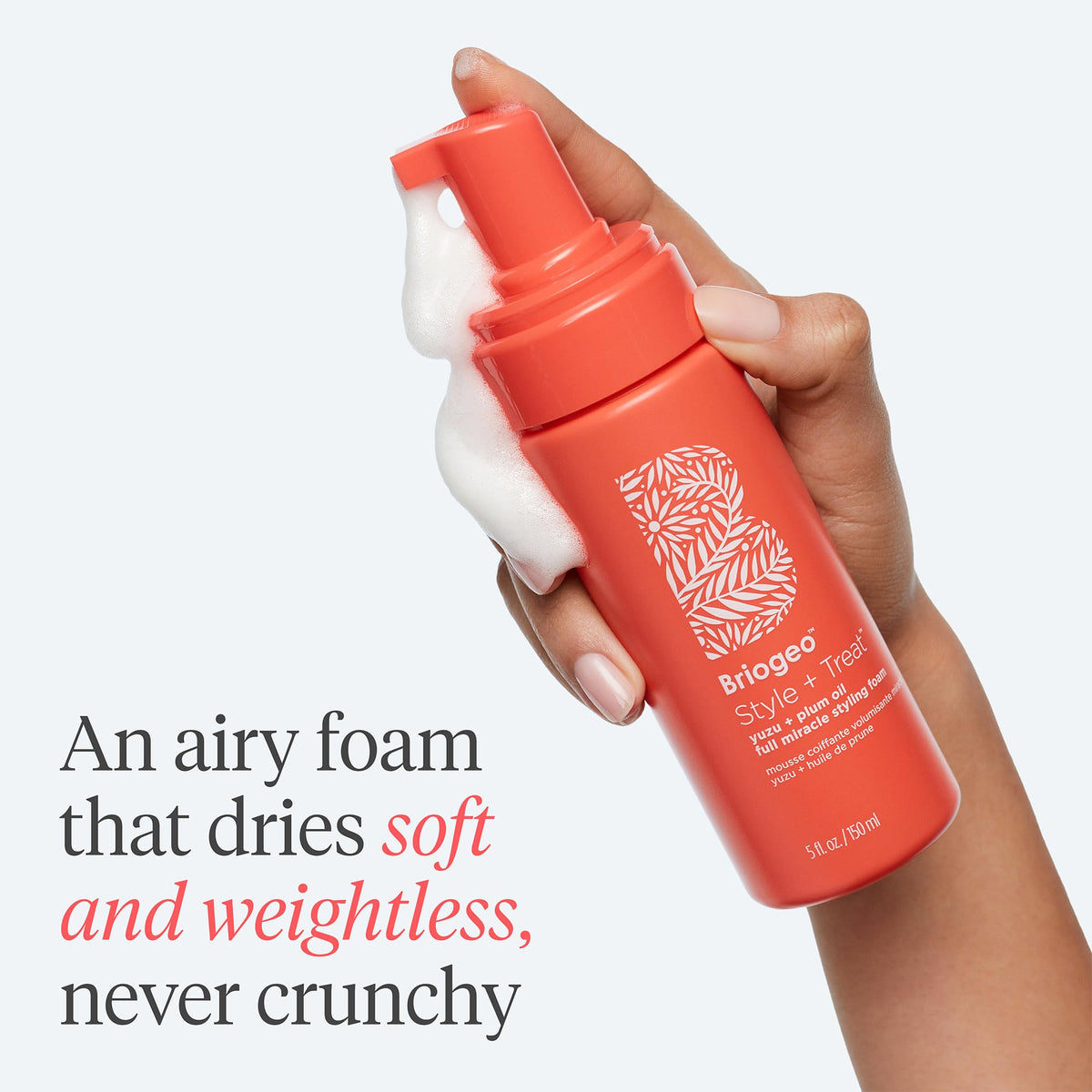 Close-up of Briogeo product label highlighting clean ingredients and heat protection claim