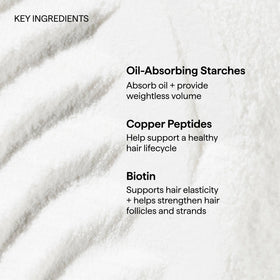 Briogeo model refreshing hair outdoors for instant volume