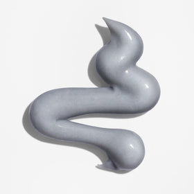 Briogeo close-up of mask texture illustrating creamy charcoal consistency for effective detox
