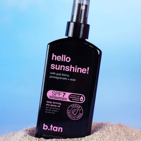 B.TAN in beach setting illustrating outdoor tanning convenience
