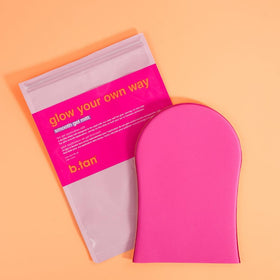 B.TAN mitt on bathroom counter next to tanning bottle showing ready-to-use routine