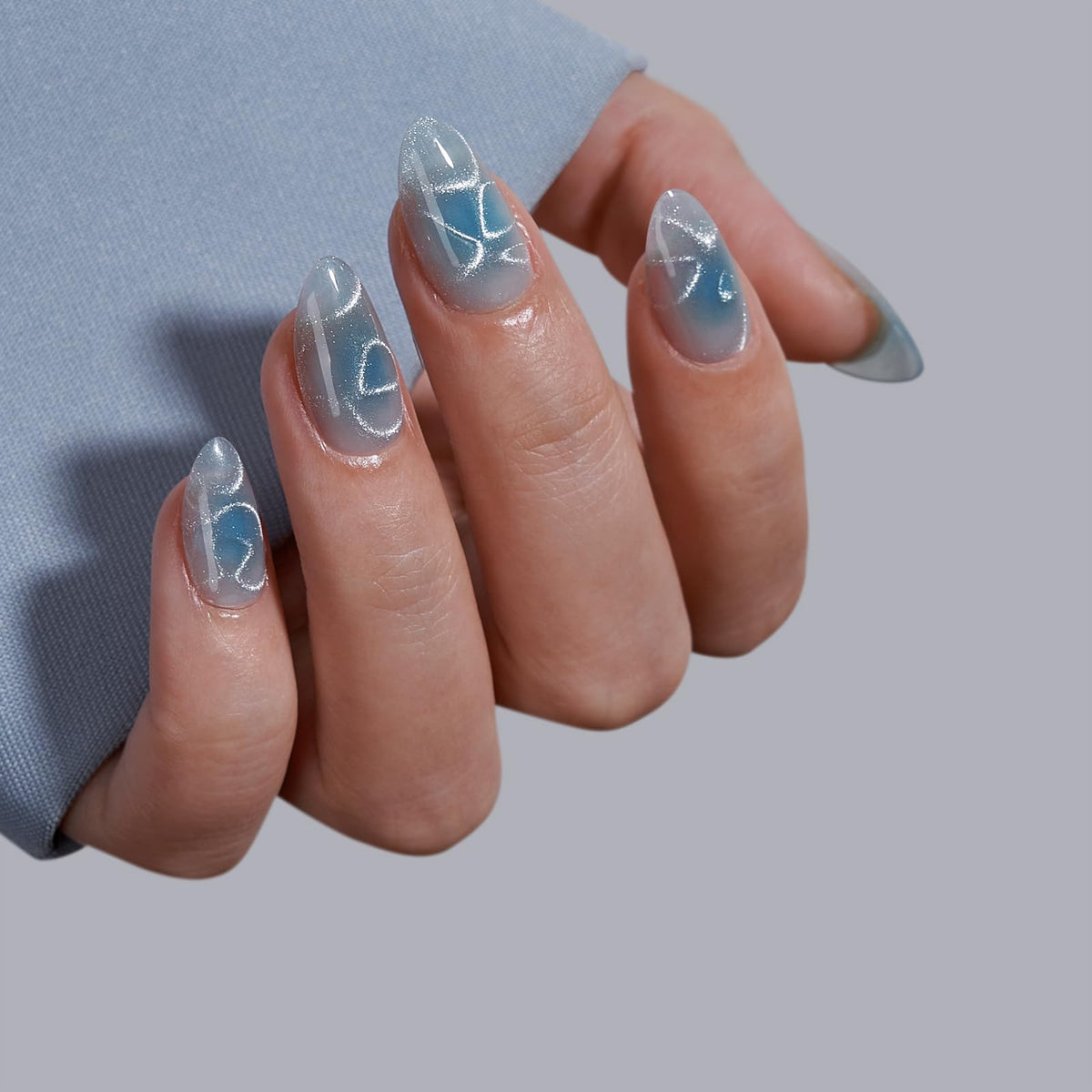 BTArtbox nails in hand displaying short almond shape and natural look