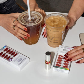 BTArtbox nails in hand to show medium almond length and realistic scale