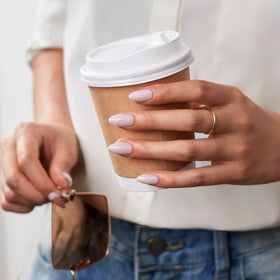 BTArtbox nails in hand displaying short almond scale for natural fit