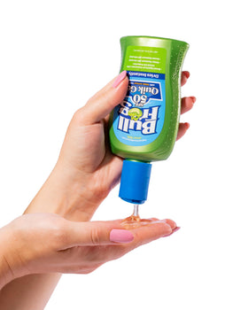 Bullfrog Quik Gel in beach setting showing sweat-resistant protection during outdoor activity
