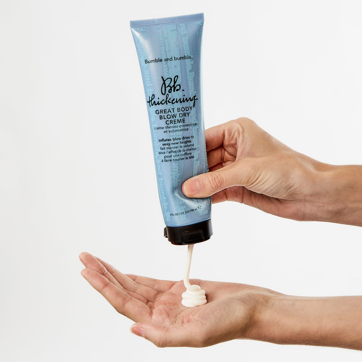 Bumble and bumble cream applied to damp hair for heat styling protection